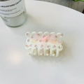 Detailed view of white acrylic hair claw with pink floral pattern and sheer ribbon bow - Acrylic / Pink Ribbon Floral Cookie