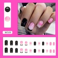 Detail view of pink gradient and black French tip press-on nails with glitter hearts - Rose Pink Heart (W509)