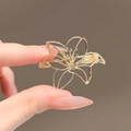 Elegant gold lily flower brooch with a hollow metal design for a minimalist style - 387# Hollow Petals