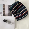 Detailed view of the navy blue pleated fabric texture with colorful diamond geometric patterns - Navy Geometric Shrapnel Bag
