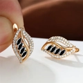 Leaf shaped earrings in champagne gold finish with black and white zircon stones - Champagne Gold Black Stone