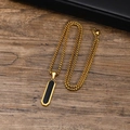 Macro detail of geometric long bar pendant with black inlay on a golden chain - PN-1760 Gold Pendant + 60cm Chain