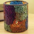 Colorful mosaic glass candle holder with warm glow on wooden surface for home decor - Mixed Patterned