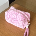 Cute pink leopard print plush cosmetic bag with a zipper and hand strap for travel - Handheld Plush All Pink Leopard