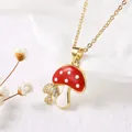 Macro view showing the detailed red mushroom enamel pendant with sparkling cubic zirconia - Double Mushrooms