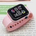 Pink sport digital watch with square black dial showing heart rate and steps counter - Pink