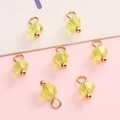 Seven yellow crystal beads with gold metal loops and beads for DIY jewelry making - Yellow Bicone Bead