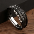 Close-up of black braided leather bracelet with silver beads and magnetic clasp detail - Black
