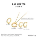 Detail of C-shape stainless steel jewelry set with sparkling cubic zirconia inlay - Size 6 / Round Zirconia Jewelry Set (KS221849-K) / Gold