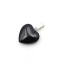 Polished black obsidian heart pendant with a silver metal clasp on white background - Obsidian