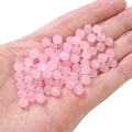 Pink round glass jelly beads held in hand for DIY handmade jewelry crafting - Pink approx 50pcs/pack