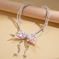 Elegante collana multistrato di perle con fiocco di nastro a pois e catene d'argento - Rosa