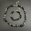 Detail view of irregular black and grey crystal stone necklace and bracelet jewelry set - Bracelet / Snowflake Obsidian