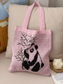 Pink knit tote bag featuring cute panda pattern and green bamboo leaf accents - Pink