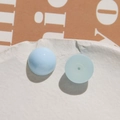 Macro view of light blue resin beads with smooth surface and flat back with center hole - Light Blue Round