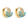 Detailed macro view of 18K gold plated huggie hoops with blue enamel and clear zircon - Blue Wing Style (42162)