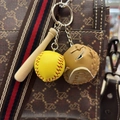 Miniature baseball keychain set with glove and bat hanging on a stylish handbag - 3.5CM Yellow Ball Khaki