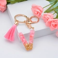 Pink resin letter V keychain with gold foil flakes, tassel and metal keyring - Letter V