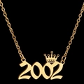 Gold lucky number necklace with 2002 pendant and crown detail on black background - 2002 / Gold