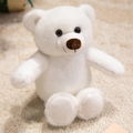 Plush white cartoon teddy bear soft toy with brown eyes sitting on a warm beige rug - White Bear (Naked) / White