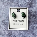 Detailed view of Halloween ghost cat earrings with green glow-in-the-dark skeleton pattern - Black Skeleton Cat