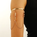 Gold upper arm bracelet with hanging chains and seashell charms in bohemian style - Shell Tassel Style (5950)