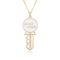 Detail of 18k gold heart key pendant with Good Luck engraving and zircon stones - Good Luck Enamel Disc Key Style (c184)