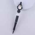 Macro detail of cartoon penguin silicone bead pen with shimmering rhinestone spacers - Black Penguin
