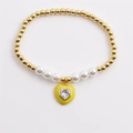 Bracciale a sfere dorate con perle bianche e ciondolo a cuore in smalto giallo con zircone - Giallo