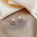 Detailed close-up of rose gold pearl stud earrings with sparkling zircon halo on silk - Rose Gold Pearl Zirconia Hoop Studs