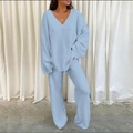 Close-up of light blue flannel lounge set featuring V-neck long sleeves and wide-leg pants - Blue