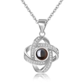 Silver projection necklace featuring a knot pendant with micro-set zircons and round stone - Double Oval Silver