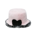 Close-up of pink faux fur bucket hat featuring a large black bow and soft plush texture - M (56-58cm) / Pink