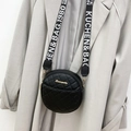 Black quilted circular crossbody bag with wide logo strap and golden metal hardware - Black
