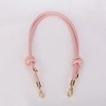 Pink PU leather shoulder strap detail featuring gold metal buckles and a knotted design - Pink