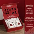 Wedding gift box with male and female sculpture candles in red festive packaging - Cocoa Liqueur + Ebony Engagement Edition