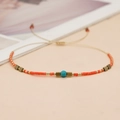 Handmade coral beaded bracelet with turquoise accent and adjustable beige cord string - Coral Turquoise Gold Mixed