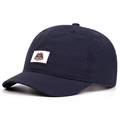 Close-up view of dark blue short brim quick-dry baseball cap with camping adventure patch - Adjustable / Navy Blue
