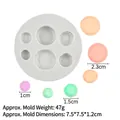 Detail of 6-cavity macaron silicone mold showing different sizes from 1cm to 2.3cm - 4# 16083 / Gray
