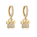 Detailed close-up of golden paw print earrings with sparkling white crystals - Gold White Zircon Cat Paw Hoop Earrings