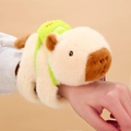 Plush Capybara slap bracelet toy with green backpack worn on wrist for kids - Beige Sporty Capybara Slap Bracelet (Fixed Tail)