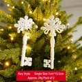 Set of 2 white glittery key-shaped Christmas ornaments with snowy texture - Key Style