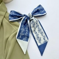 Floral print silk scarf in navy blue and white, tied as a bow for hair or bag styling - Blue Small Vine Floral