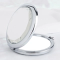 Silver round folding makeup mirror with large faceted crystal on white silk - Diamond Round Mirror Silver Frame Clear Gem