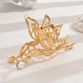 Golden Y2K metal hair claw clip with pearl accents in an elegant butterfly design - Gold