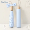 Sky blue folding umbrella with matching case and wooden handle for sun protection - Light Blue