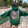 Green oversized hoodie with pink cherry blossom print and religious text on the back - S / Dark Green