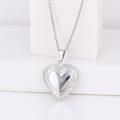 Silver heart-shaped locket necklace with vintage swirl engraving on a clean white base - Ruyi Heart 22*20/Steel