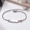 Detail of silver stainless steel bracelet featuring a pink enamel heart and engravable plate - Silver