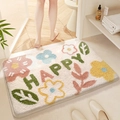 Saugfähige Badematte mit Blumenmuster und Happy-Schriftzug im Badambiente - Erdnuss-Weiß / 50*80cm